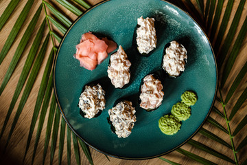 japanese sushi food. Maki ands rolls with tuna, salmon, shrimp, crab and avocado. Top view of sushi.