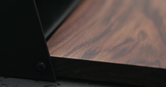 Slow motion man hand check walnut wood breadbox