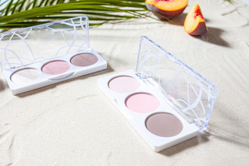 The sculpting palette lies on the beach sand, surrounded by vibrant fruits, corals, and palm leaves.