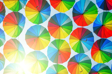 Fototapeta na wymiar Bright colored umbrellas as a background