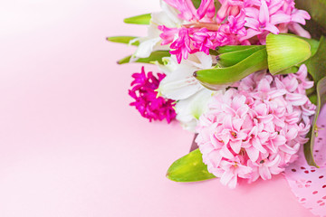 Spring banner with hyacinth flowers on pink pastel background with copy space. Top view, flat lay. Mother's Day or Woman Day Concept