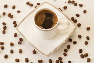 A cup of coffee bean concept on the white background.