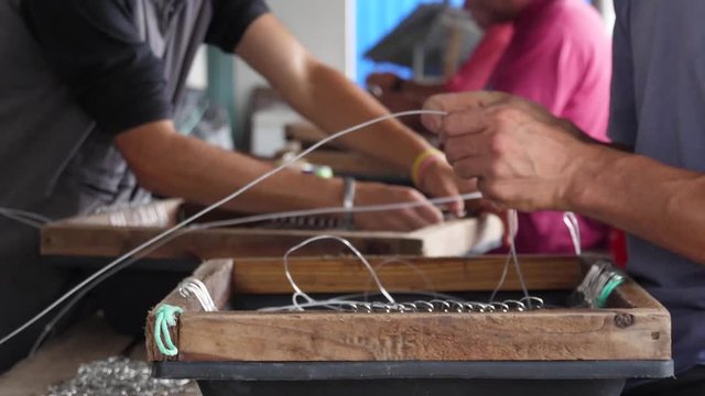 fishermen preparing fishing hooks