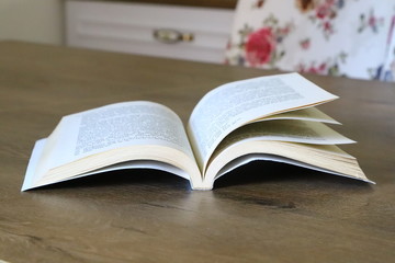 open book on wooden table