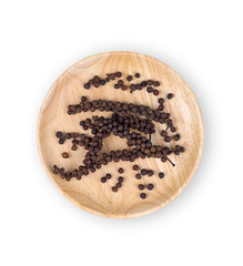 Black pepper in wooden plate isolated on white background.