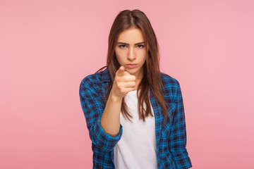 Hey, you are guilty! Portrait of girl dissatisfied with your behavior pointing finger to camera,...