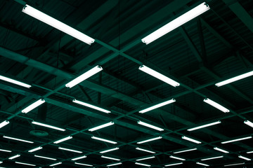 Background texture geometric the night of the green and blue color. Ceiling halogen spotlight light indoor.