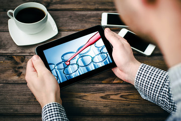 Internet information Covid-19 epidemic spread. Tablet science news reading. Laboratory test tube....