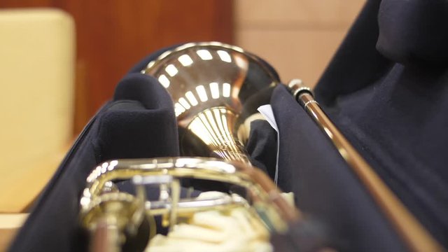 Musician Taking Trombone From Trombone Case