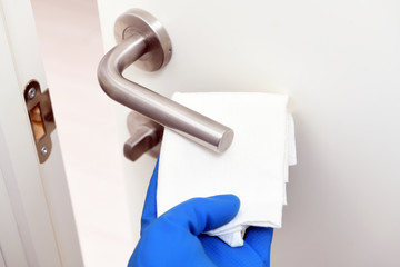 Disinfection in public places, the fight against the virus, coronavirus.Worker's hand wipes the...