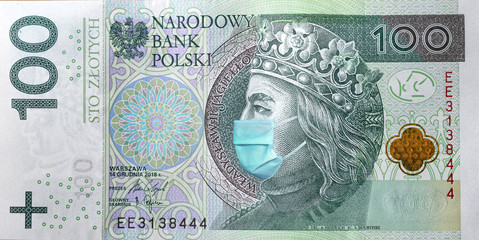 Coronavirus in Poland. Quarantine and global recession. 100 Polish zloty banknote with a face mask...