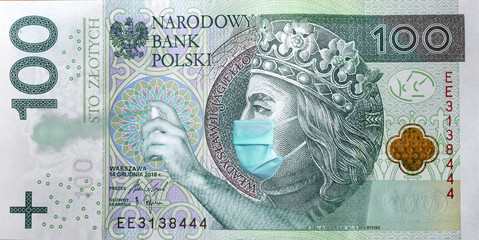 Coronavirus in Poland. Quarantine and global recession. 100 Polish zloty banknote with a face mask and antibacterial spray against infection. Global economy hit by corona virus covid19 outbreak and pa
