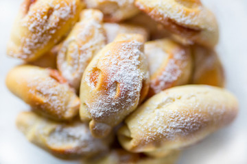 homemade sweet cakes filled with jam from rolled out yeast dough