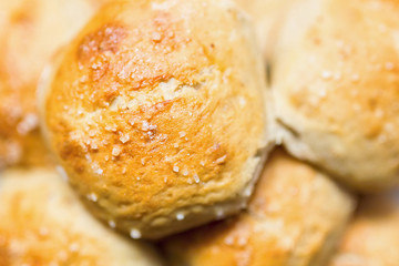 Fresh salty bread buns pastry topped with salt