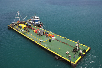 A tugboat pushing a barge