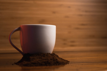 cup of coffee on wooden table