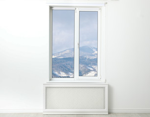 Beautiful view of snowy mountains through window
