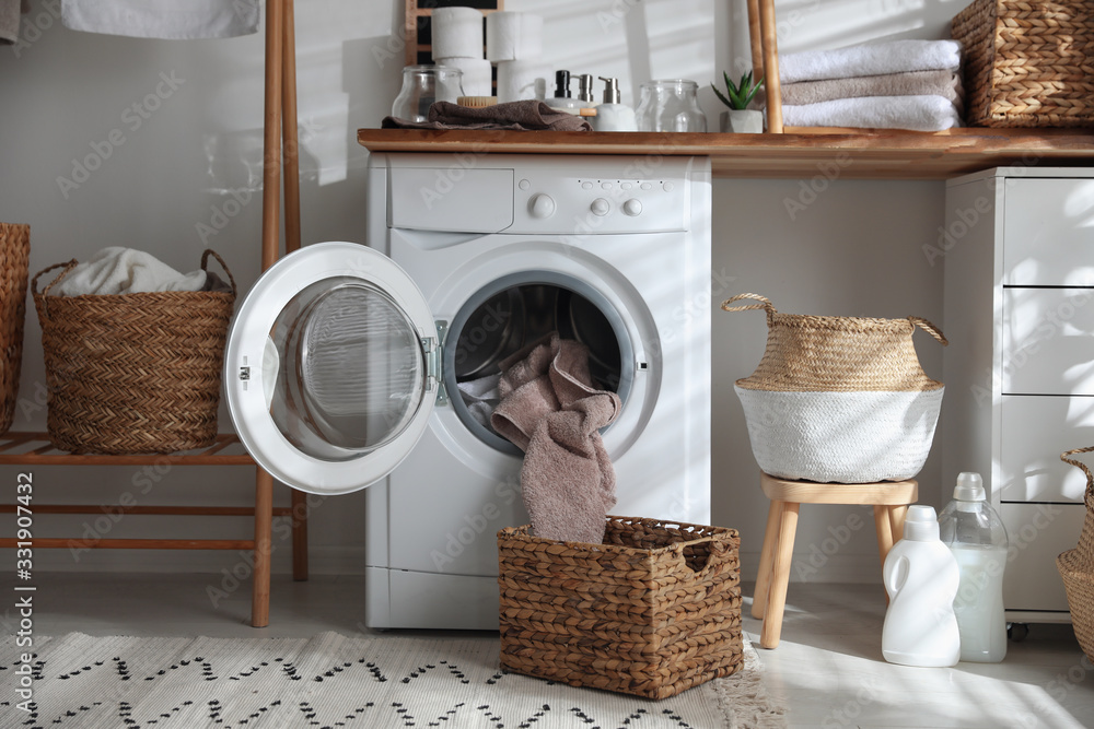 Poster Stylish bathroom interior with modern washing machine