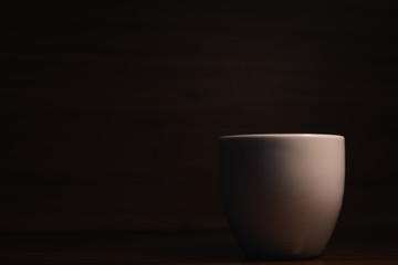 cup of coffee on black background