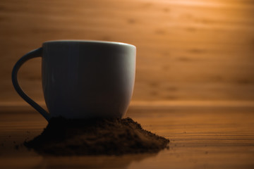 cup of coffee on wooden table