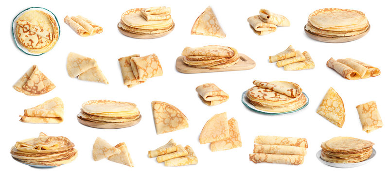 Set of delicious thin pancakes on white background