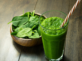 spinach smoothies in glass is on table