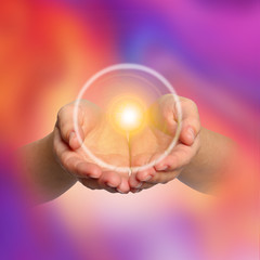 Woman holding concentrated healing energy in her hands, closeup