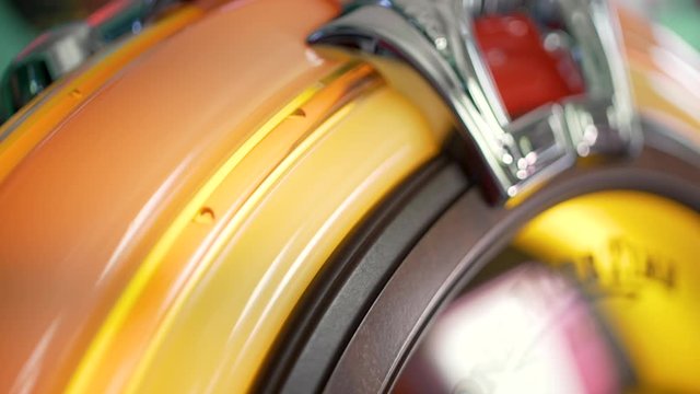 Following the water bubbles in an american vintage jukebox out of the fifties with the camera in extreme close up with a shallow depth of field