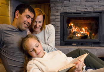 Happy Christmas family, Loving parents with child girl sitting n
