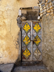 Wooden door of old houses, hamlet in mountains, Oman
