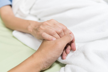 Love couple hold patient in hospital ward close up.