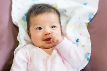 Cue Asian baby close up