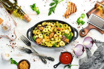 Italian cuisine. Ravioli with onions and mustard. Top view. Free space for your text. Rustic style.