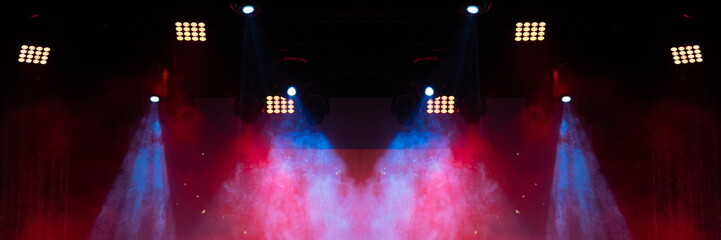 Theater stage, colored puffs of smoke in stage light