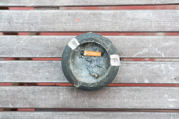 top view ashtray on wooden table