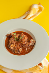 Lamb stew with aromatic herbs seen from above