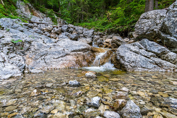 Beautiful streams and small waterfalls on the Eibsee at the Zugspitze