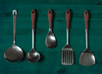 kitchen utensils on wooden background