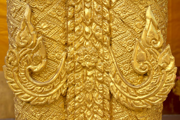 Fototapeta na wymiar Beautiful golden stucco in Thai temple