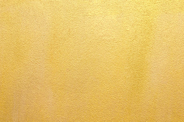 Gold concrete wall on background texture.