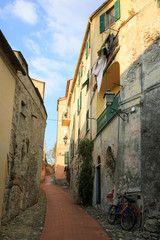 Finalborgo (SV), Italy - December 12, 2017: A typical house and pathway in Finalborgo village, Finale Ligure, Liguria, Italy