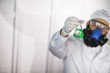 Naklejka premium A scientist researcher in the laboratory is testing drugs for the treatment of viral pneumonia. Coronovirus blood test of infected patients. World pandemic.