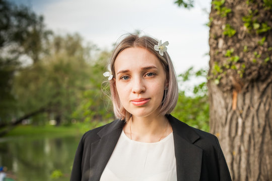 Cute girl in spring park portrait