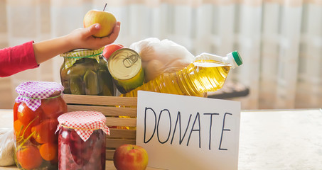 Food and plate with text for donation. Selective focus.