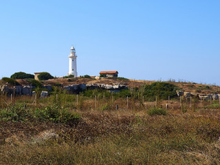 Fototapeta na wymiar Lighthouse on the coast of Paphos Cyprus near the archeological site