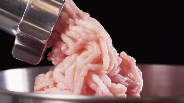 Meat grinder, grinds the meat into minced meat. Minced chicken.