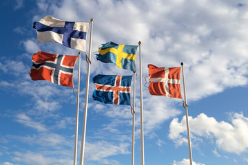 Scandinavian flags towards blue sky