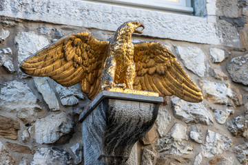 Sculpture of a golden eagle on a building in Stolberg, Eifel