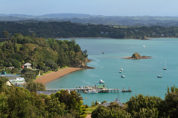 Fototapeta na wymiar Russell in the Bay of Islands, New Zealand. The town's wharf sticking out into Kororareka Bay 