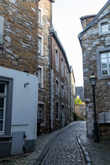 Narrow road with cobblestone pavement and historic buildings in Stolberg, Eifel